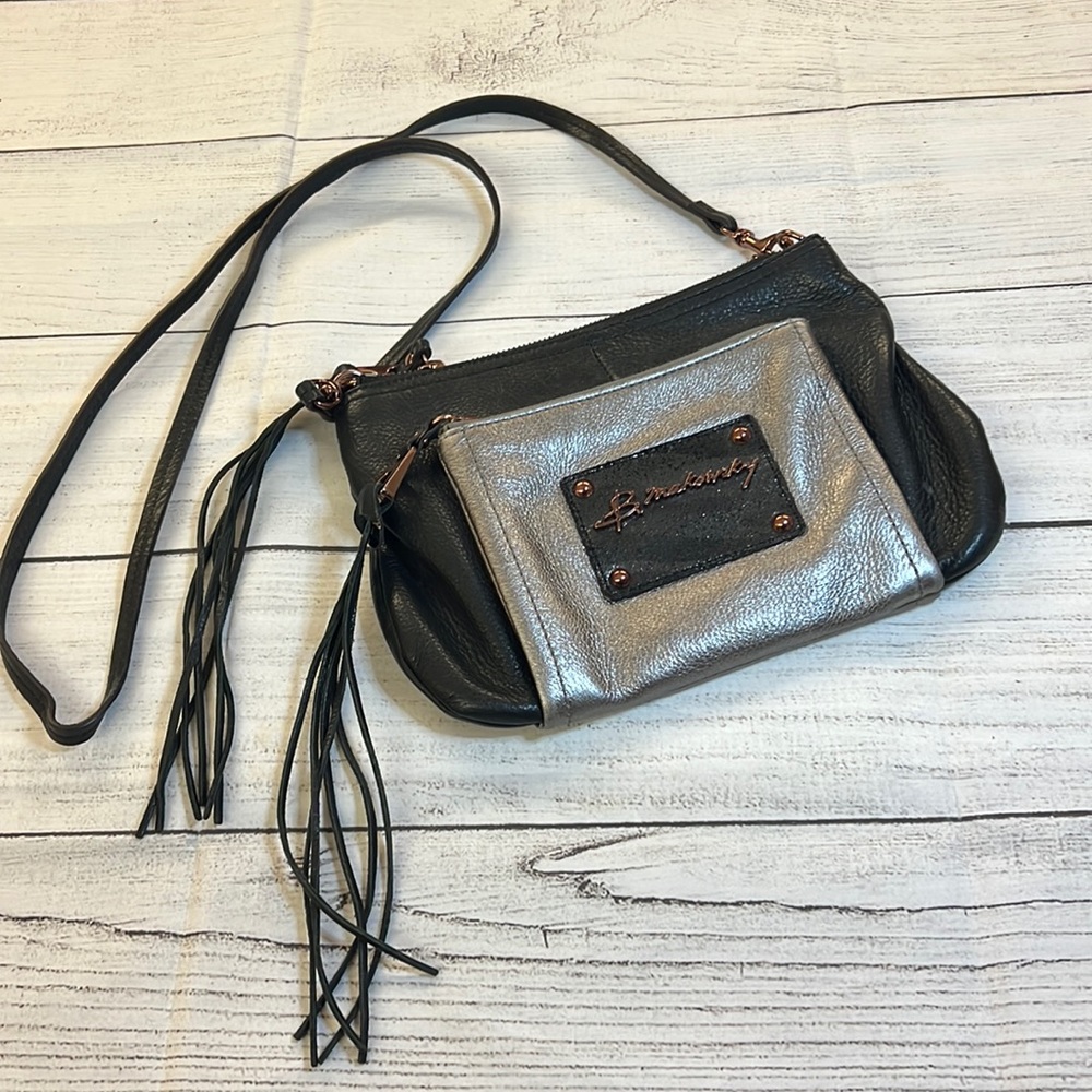 B.Makowski leather black/silver clutch bag with interior animal print/tassels